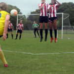 Emily Link and Larissa Vieira jump in the wall